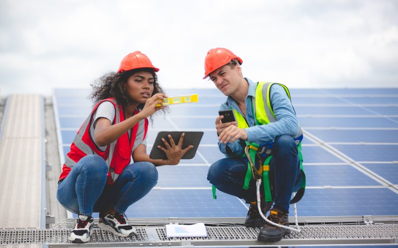 Specialist technician professional engineer checking top view of installing factory solar roof panel