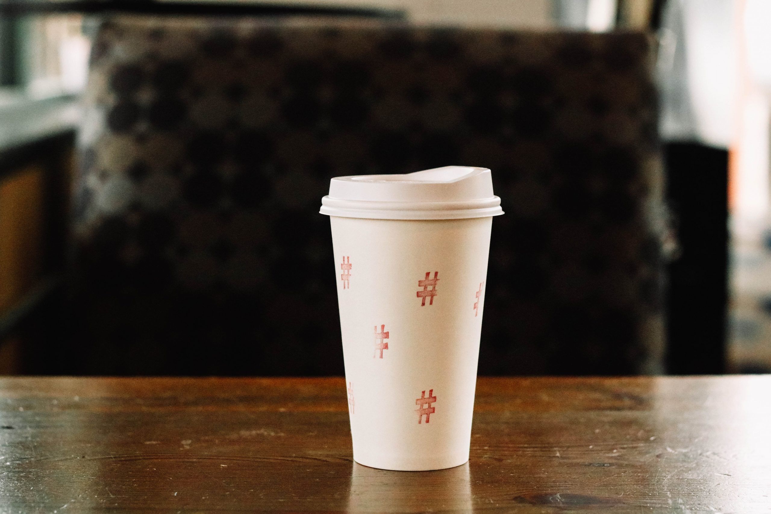 Coffee Cup Adorned With Hashtags